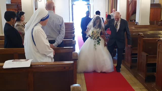 The bride is handed over to the groom.
