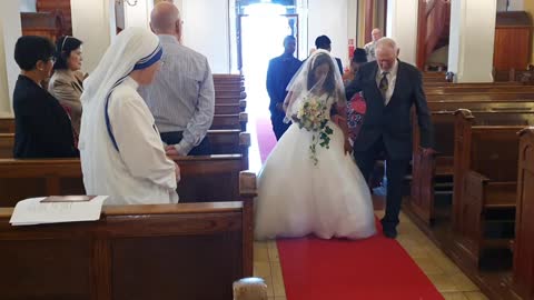 The bride is handed over to the groom.