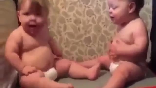 Funny kids enjoying the fun of a vibrator