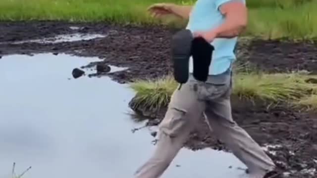 Tourist Gracefully Disappears Into A Puddle