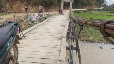 two chang boys sing around the village