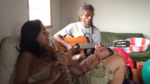 Happy Moment When Parents Sing to Their Baby