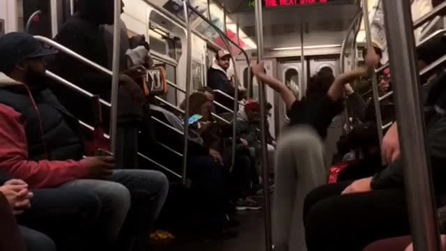 Boy curly hair sweat pants dancing in subway