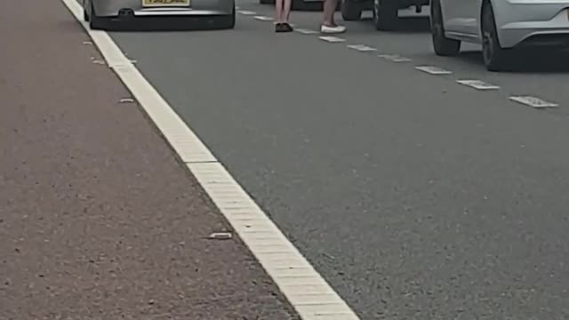 Ice Cream Truck Serving Customers on Closed Motorway