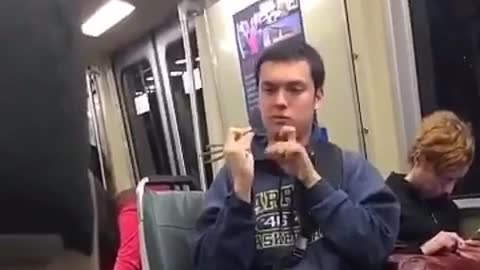 Kid in subway car flicks green bean