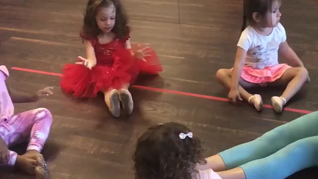 Stretching before our dance class