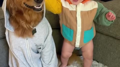 This little baby is very familiar with his dog