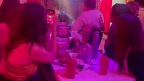 Reportedly a child drag queen performs provocatively at a bar as the adult audience cheer.