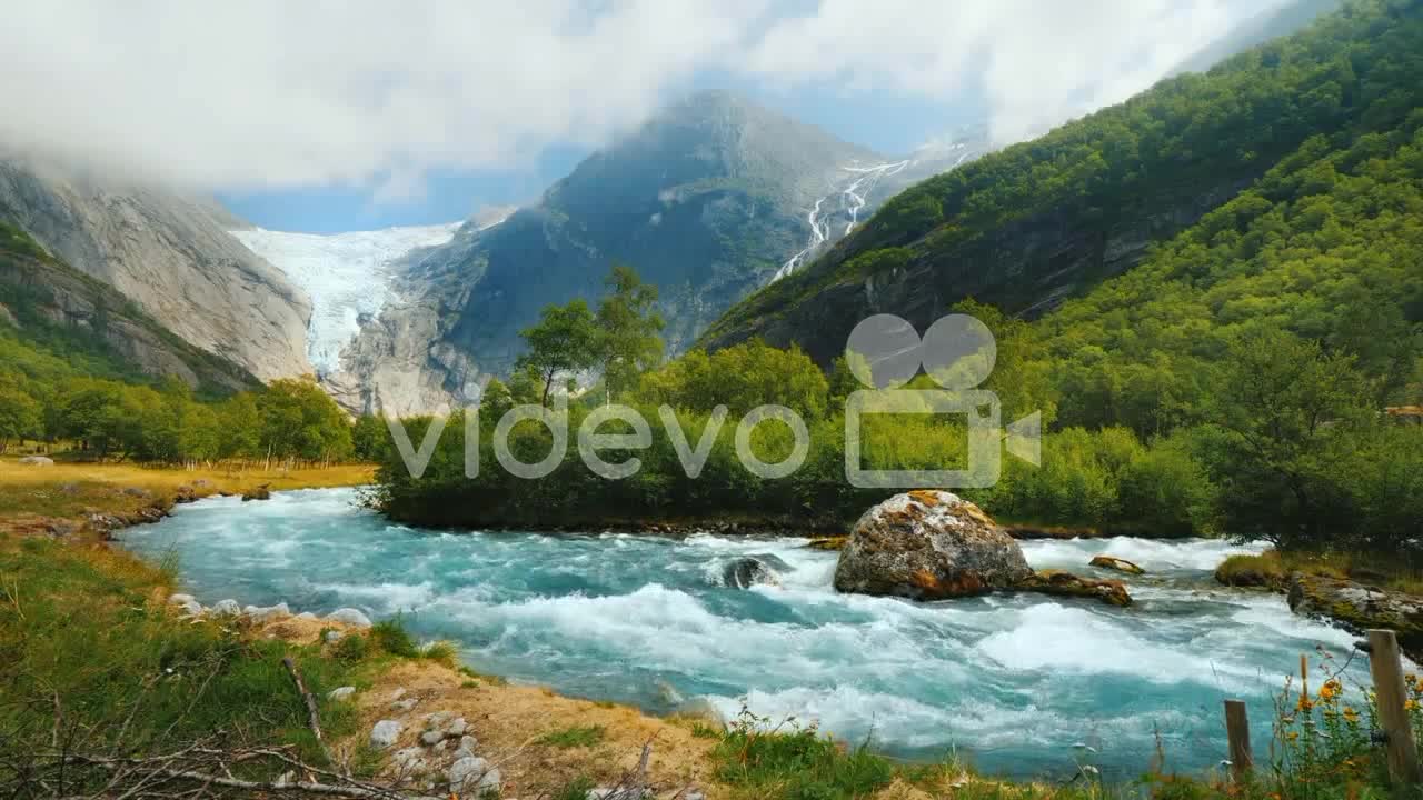 Briksdal Glacier With A Mountain River