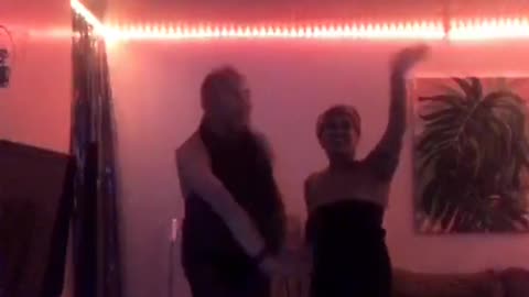 Music guy and girl walking into room and guy gets pushed