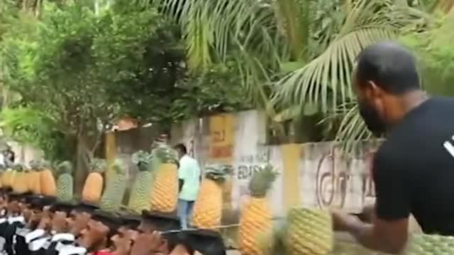 Most pineapples on head cut in half in 30 secs.: 75 by K.V Saidalavi