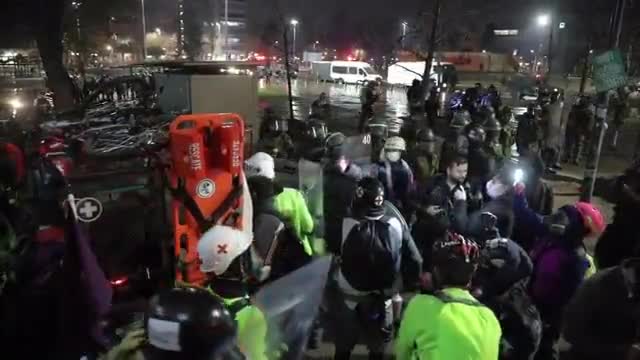 Police use water cannon as protesters demand release of detainees in Santiago