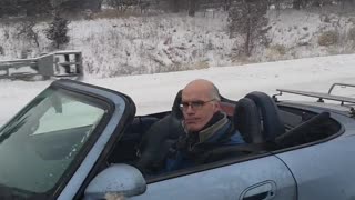 Man Drives Convertible in the Snow for Charity