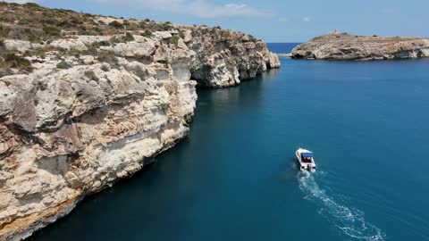 Drone Footage of a Sea Under Some Rocks