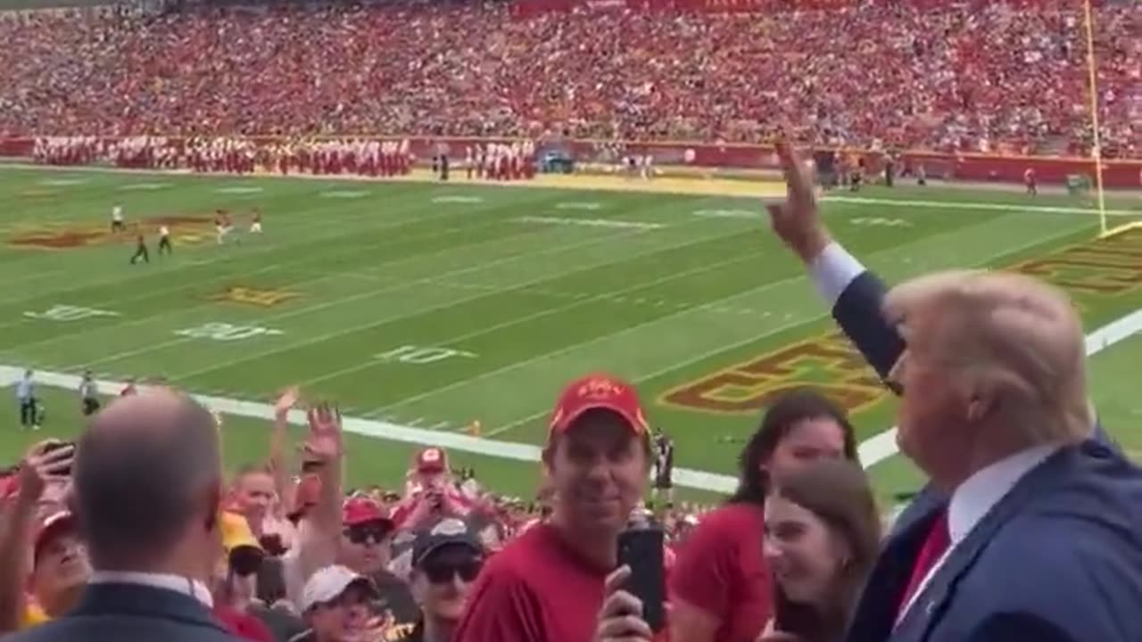 Donald Trump booed loudly by the crowd while entering a college football stadium in Iowa.