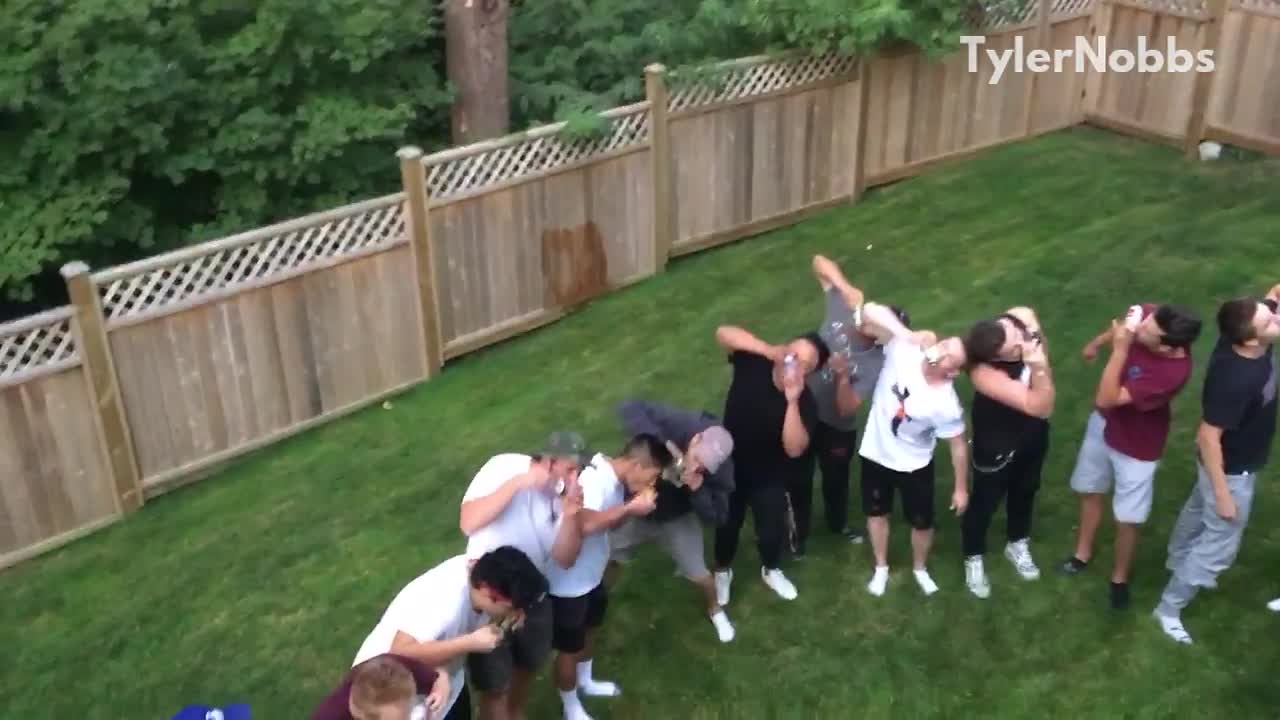 Group of friends shotgunning beer