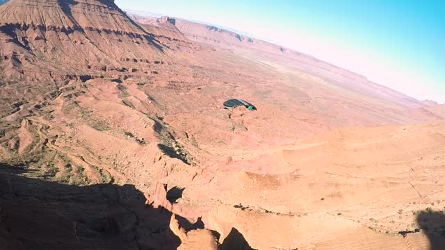 Canopy Pilots And Wingsuiter Have Close Flyby Encounter