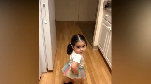 Baby shows fashion with music.