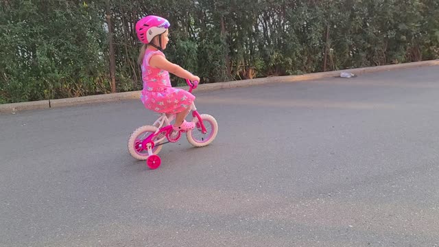 My daughter riding her bike PLEASE WATCH FOR HER READ DESCRIPTION