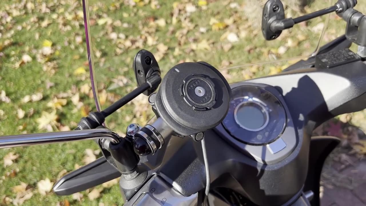 Super Cub Quad Lock Smart Adaptor and Wireless Charger on a Takegawa accessory bar