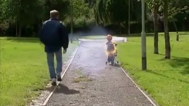 Kids learning to ride a bike with his dad-Funny