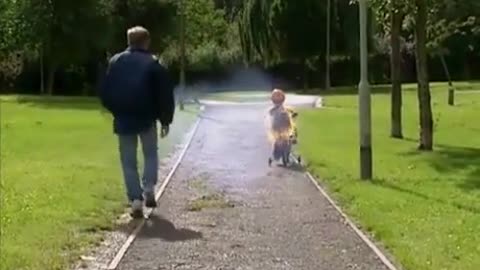 Kids learning to ride a bike with his dad-Funny