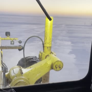 Grader on a frozen Lake