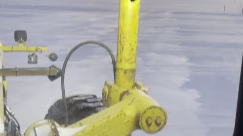 Grader on a frozen Lake