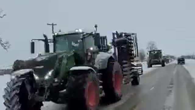 Farmers taking turns and disrupting traffic by rolling slowly near the Sarnia border.