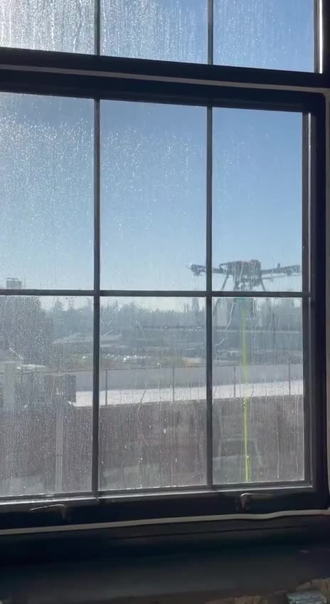 Robotic drone takes away the human job of cleaning apartment windows in New York City