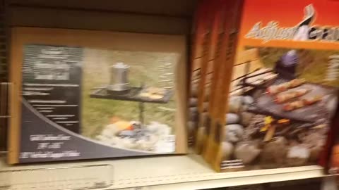 survival cooking over an open fire with Bass pro shop equipment