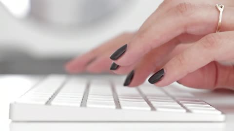 Female Hands Typing On Keyboard