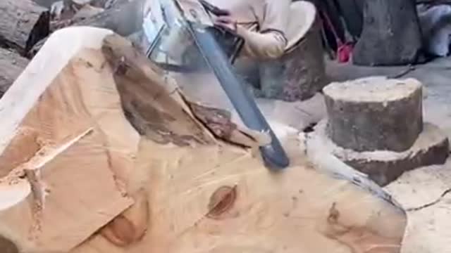 You won't believe what he does with this tree trunk!