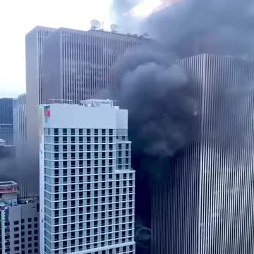 Emergency personnel responding to rooftop fire near Rockefeller Center in New York City