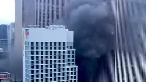 Emergency personnel responding to rooftop fire near Rockefeller Center in New York City