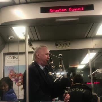 Man plays bagpipes on st. patrick's day on subway train
