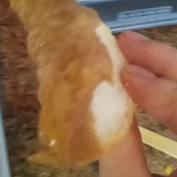 Dipping French bread into a French soup