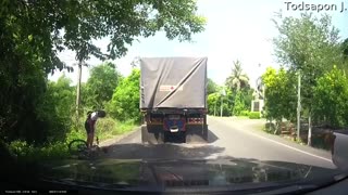 Speed Hump Nearly Sends Cyclist Under Truck