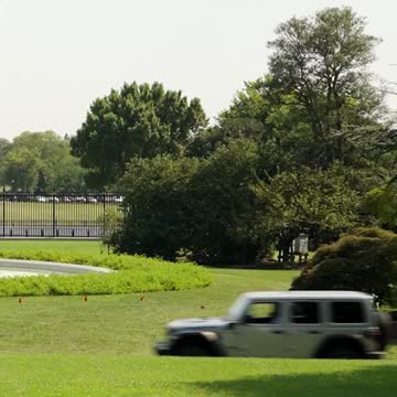 President Biden Drives an Electric Jeep on the White House South Lawn