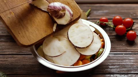 A Person Mixing All the Vegetables in a Bowl