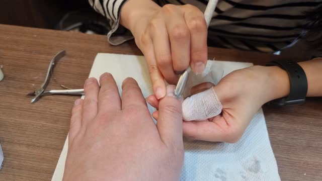 Man getting nail care