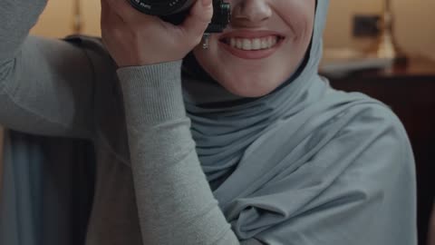 woman-camera-taking-photo-bedroom