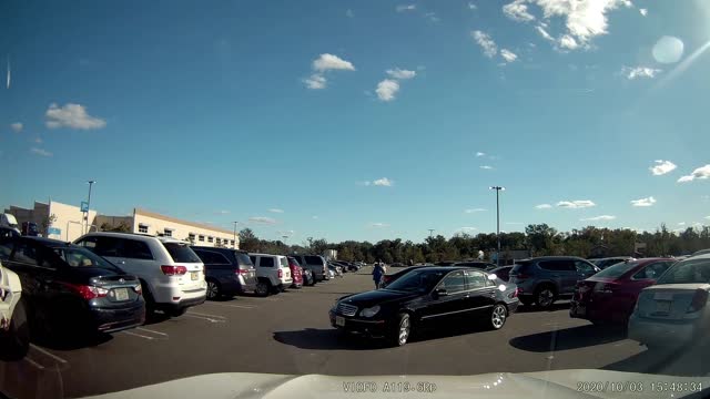 Two Vehicles Backing Out of Parking Spots Collide