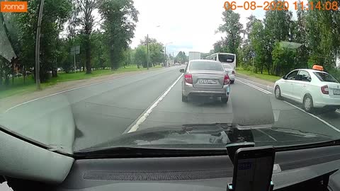 Close Call as Woman Falls While Crossing Street