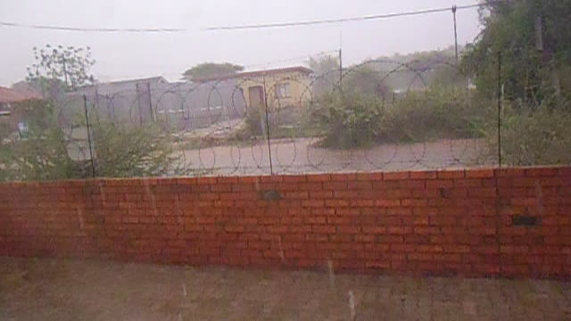 Woman Filming Storm Captures Lightning Strike Right In Front Of Her