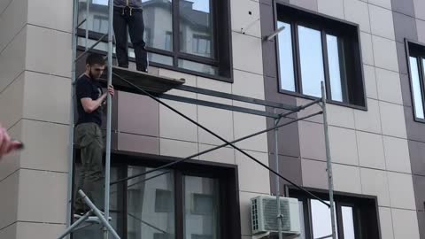 Workers Save Cat From Third-Story Window Fall