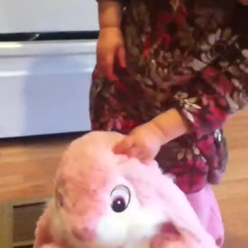 Emma and bunny clap hands