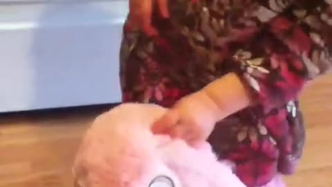 Emma and bunny clap hands