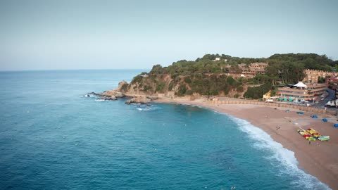 Tourist beach by apartment buildings
