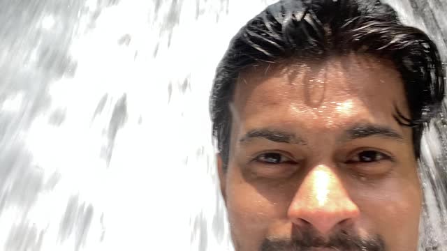 Taking shower from the Waterfall.